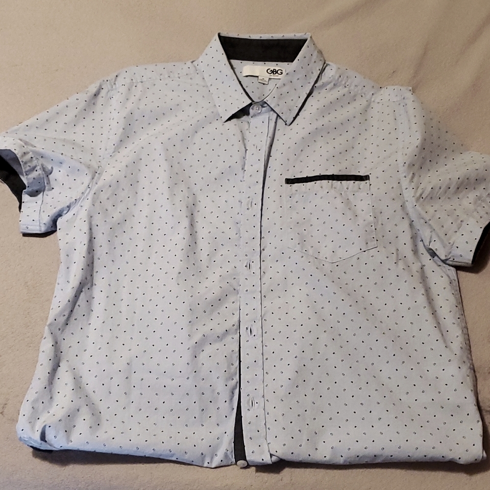Selling G by Guess button up shirt tht is a size M nd the color is light blue